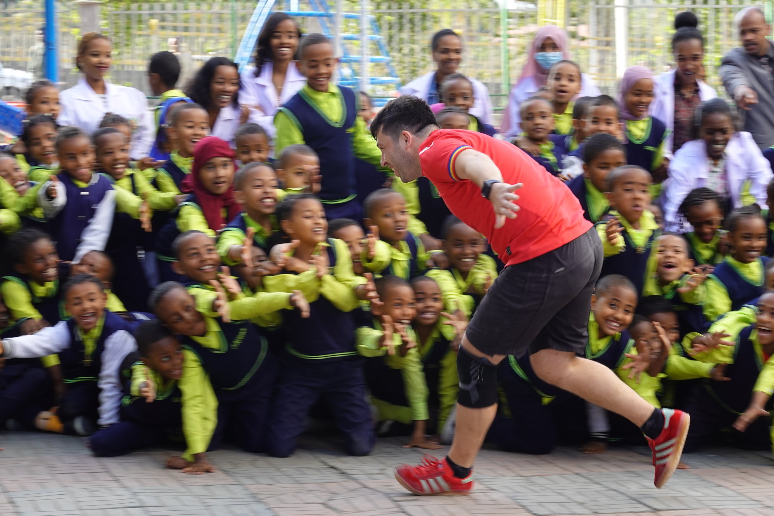 Stefan performing for a cheering school audience in Ethiopia